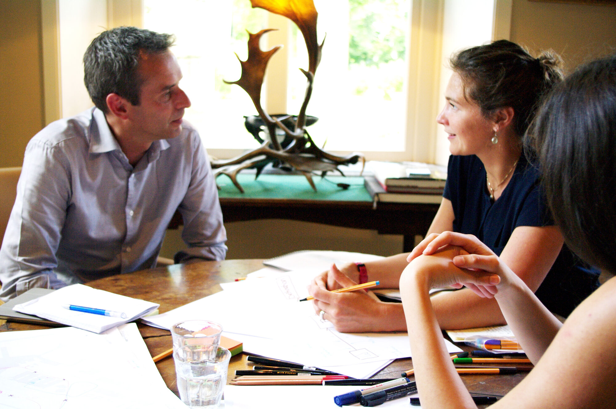 Co-design session around a table of sketches